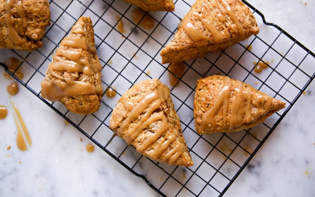 a cooling rack filled with pumpkin spice scones