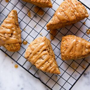 a cooling rack filled with pumpkin spice scones