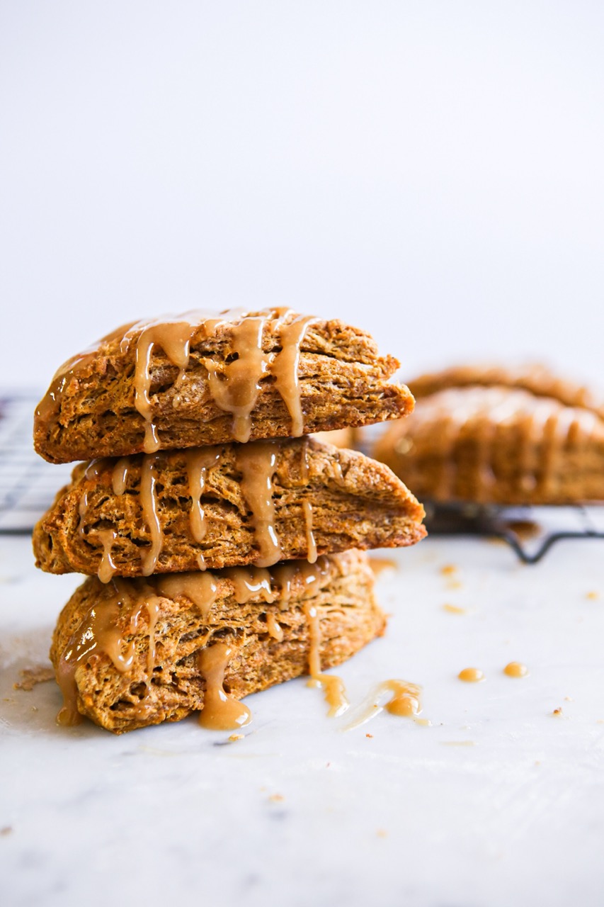 Pumpkin spice scones stacked with maple tahini glaze
